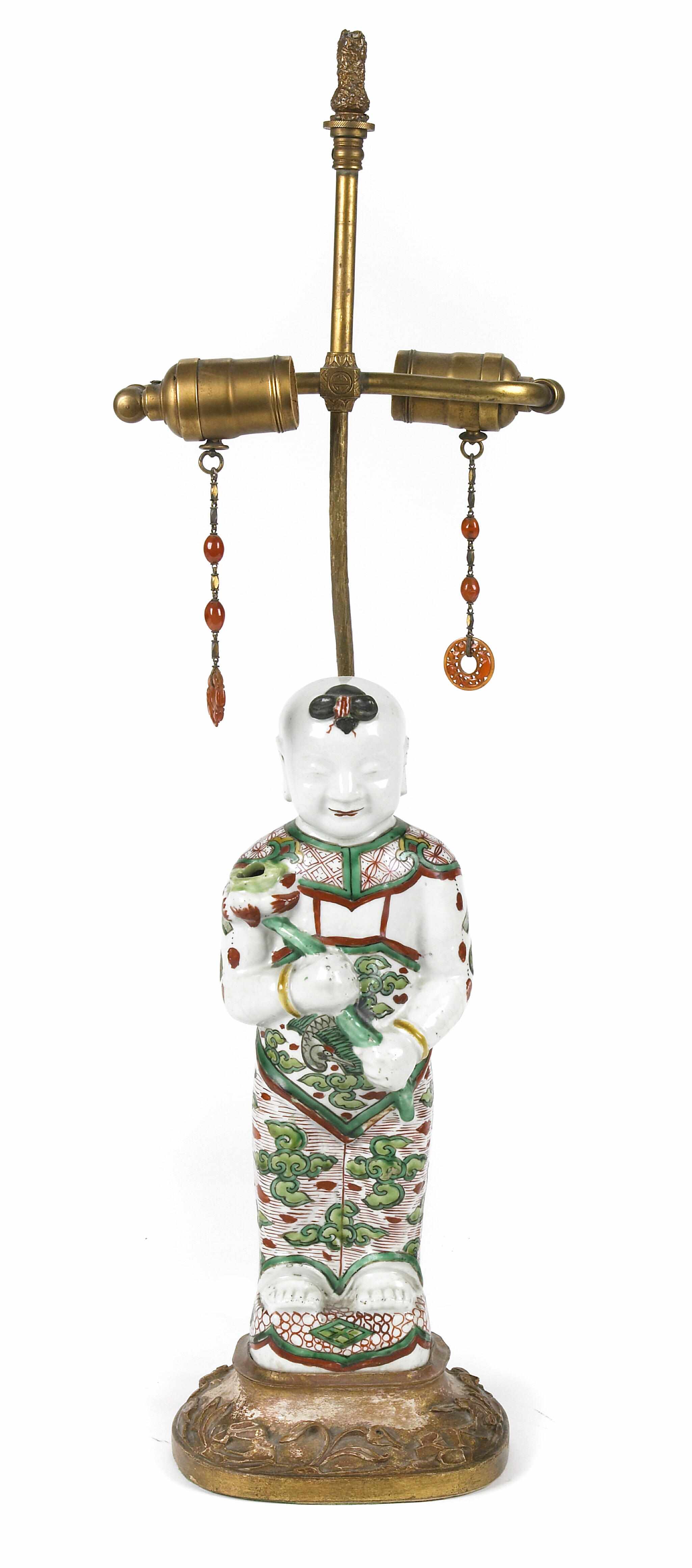 Appraisal: A Chinese porcelain figure of a Diety mounted as a