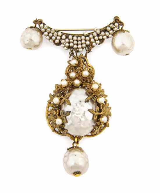 Appraisal: A Miriam Haskell Pearl Brooch with openwork scrolling designs Stamped