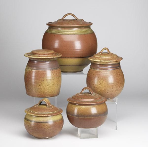 Appraisal: ROBERT CRYSTAL Five stoneware covered jars four with strap handles