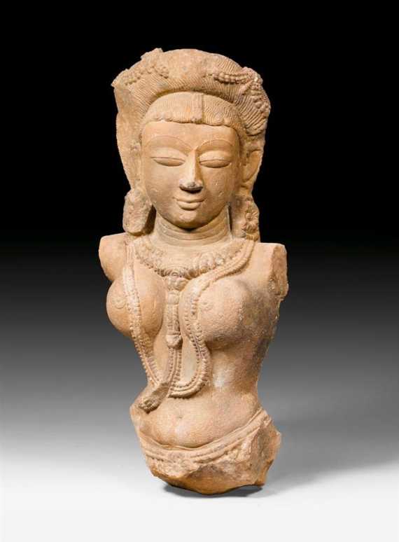 Appraisal: A FINE BUFF SANDSTONE BUST OF A YAKSHI Central India