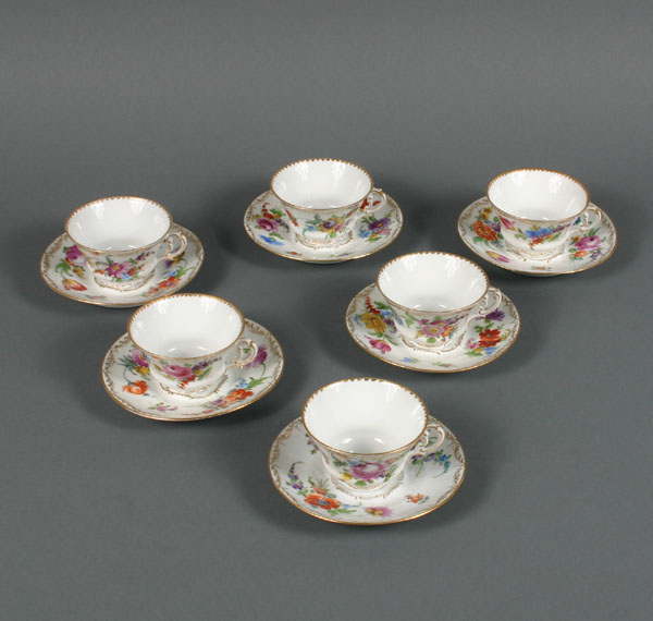 Appraisal: Dresden porcelain cups and saucers hand painted gilt flowers cups