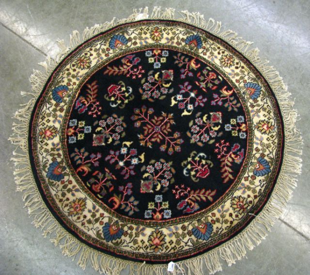 Appraisal: Oriental rug ' round circa 's black field with floral