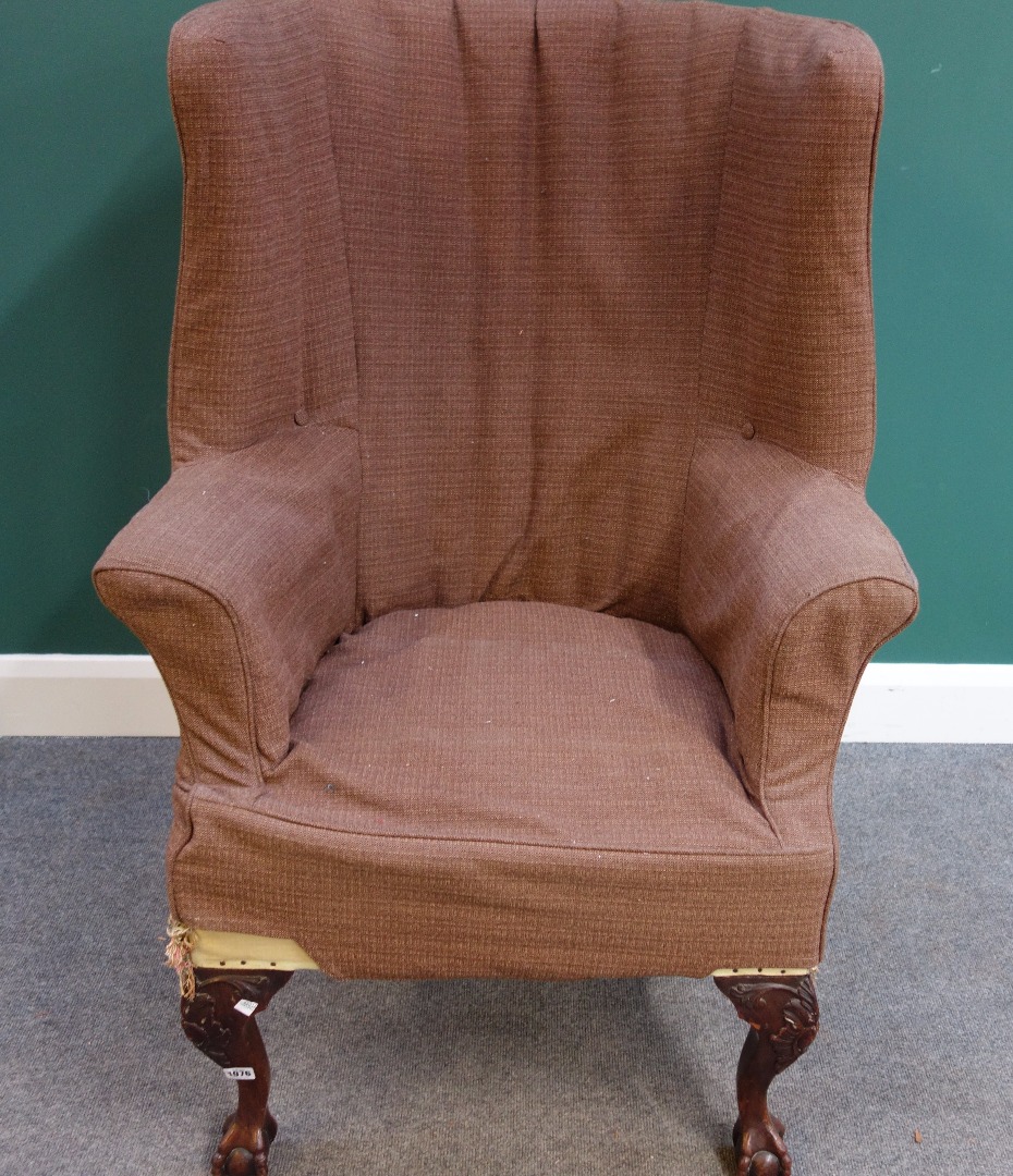 Appraisal: A George III style mahogany framed wingback armchair on claw