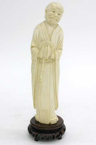 Appraisal: IVORY FIGURE OF A CHINESE SAGE hands together holding twin