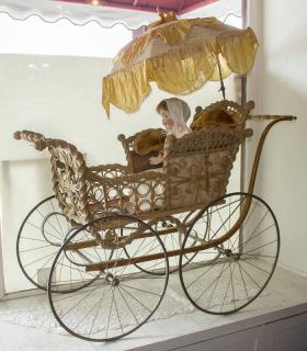 Appraisal: F A Whitney Wicker Baby Carriage with Porcelain Head Doll