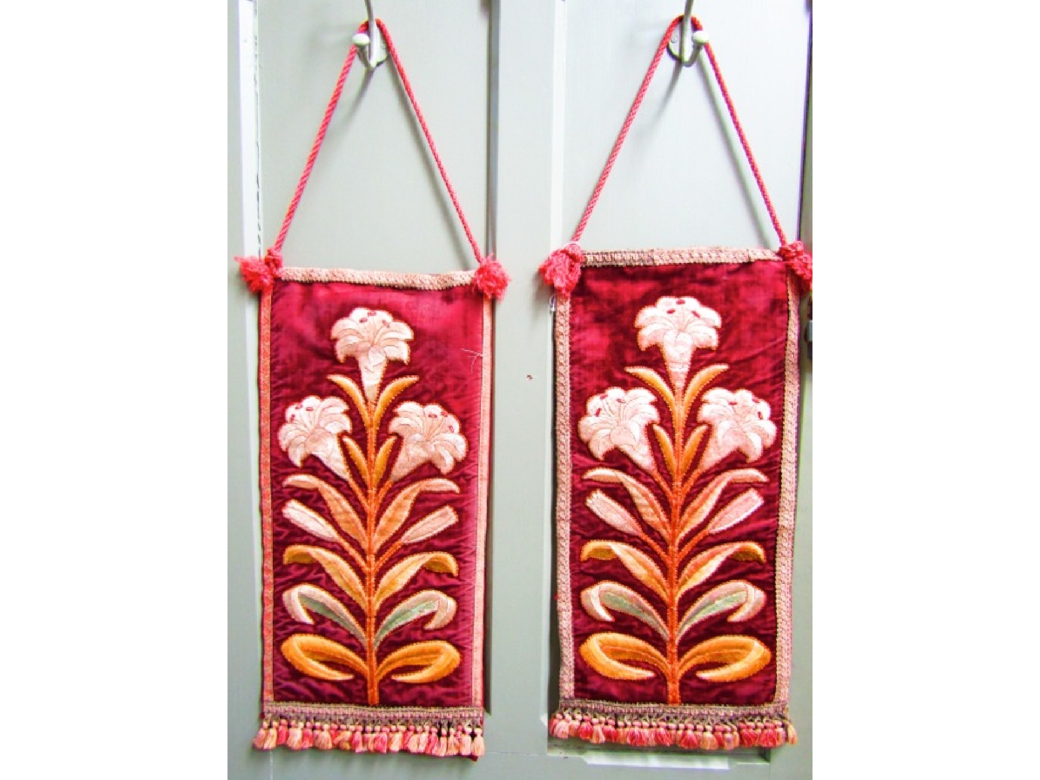 Appraisal: A pair of Ecclesiastical wall hangings with embroidered workmanship each