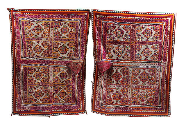 Appraisal: A PAIR OF INDIAN GUJARAT BULLOCK COVERS decorated with multicoloured