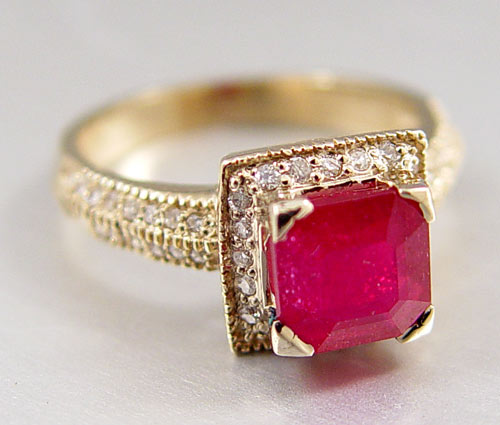 Appraisal: CT RUBY RING WITH DIAMONDS K yellow gold ring centers