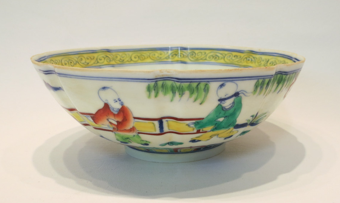 Appraisal: CHINESE PORCELAIN BOWL with lobed sides and hand enameled decoration