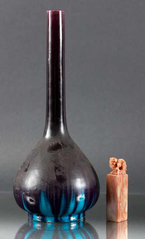 Appraisal: Chinese slip decorated bud vase together with a Chinese carved