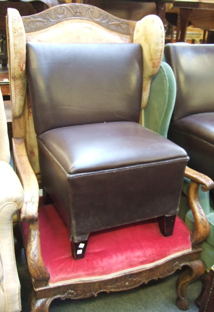 Appraisal: An th and later Italian wing armchair with humped and