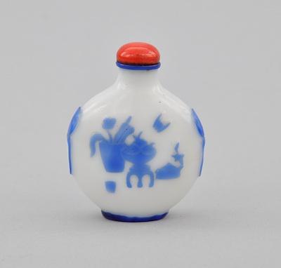 Appraisal: A Carved Glass Snuff Bottle Blue to white carved cameo