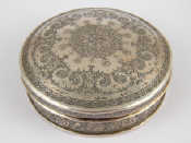 Appraisal: A circular white metal tests silver box with domed lid