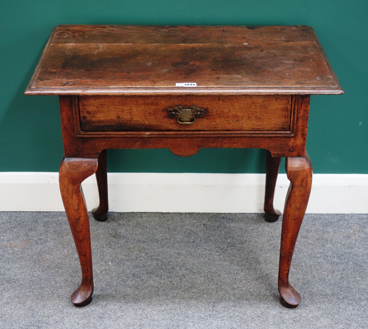 Appraisal: A mid th century oak single drawer lowboy on pad