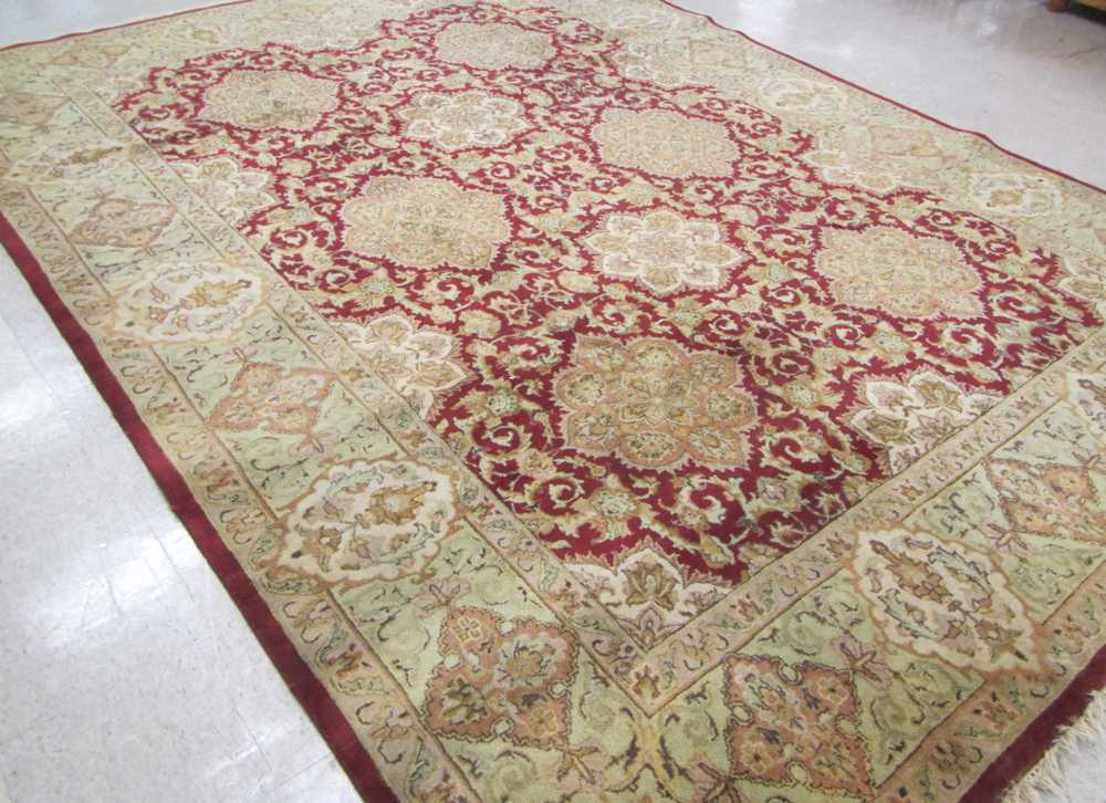 Appraisal: HAND KNOTTED ORIENTAL CARPET Indo-Persian eight medallion and stylized floral