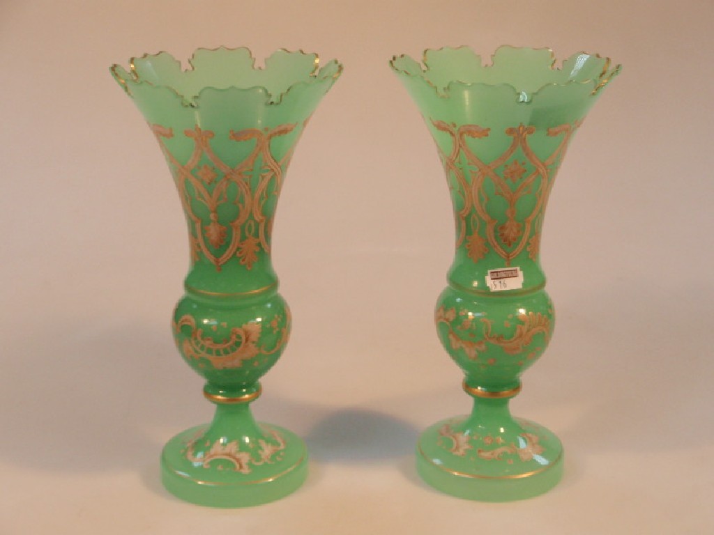 Appraisal: A pair of late thC green glass vases each with