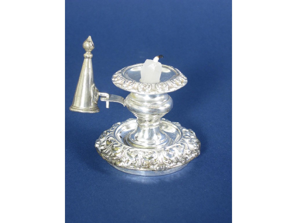 Appraisal: A George IV Taperstick with foliate bands and Snuffer Sheffield