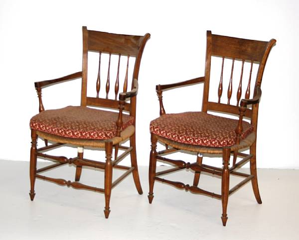 Appraisal: A pair of Charles X fruitwood and rush seat fauteuils