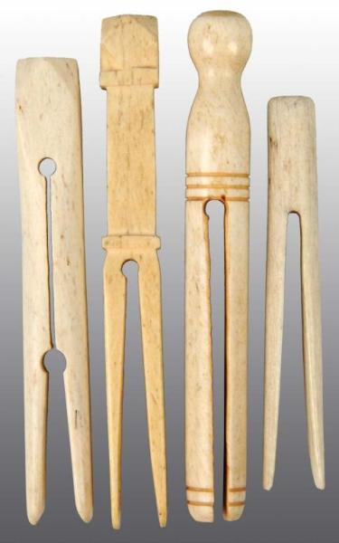 Appraisal: Lot of Scrimshaw Clothespins Description Nice detail to carving Condition