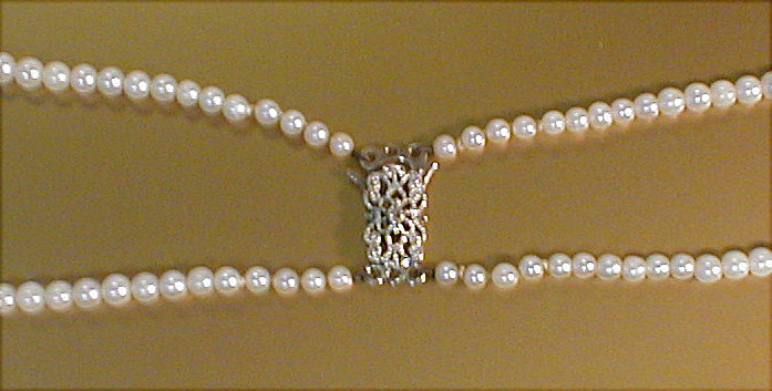 Appraisal: A two row cultured graduated pearl necklace with clasped marked