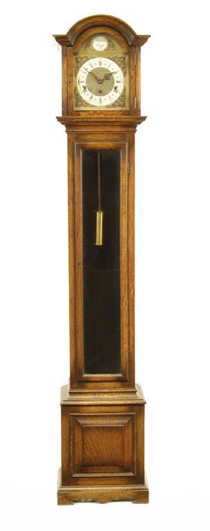 Appraisal: A miniature quarter chiming oak longcase clock