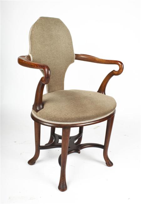 Appraisal: An th century style mahogany library armchair the shaped and