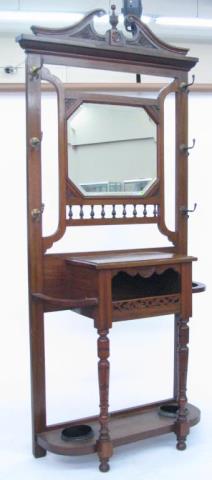 Appraisal: A late Victorian mahogany hall tree with beveled mirror approximately