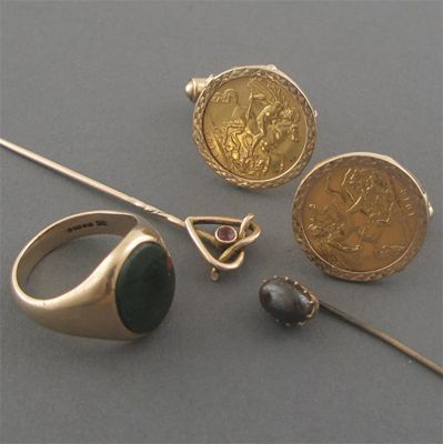 Appraisal: A pair of half sovereign mounted gold cuff links a