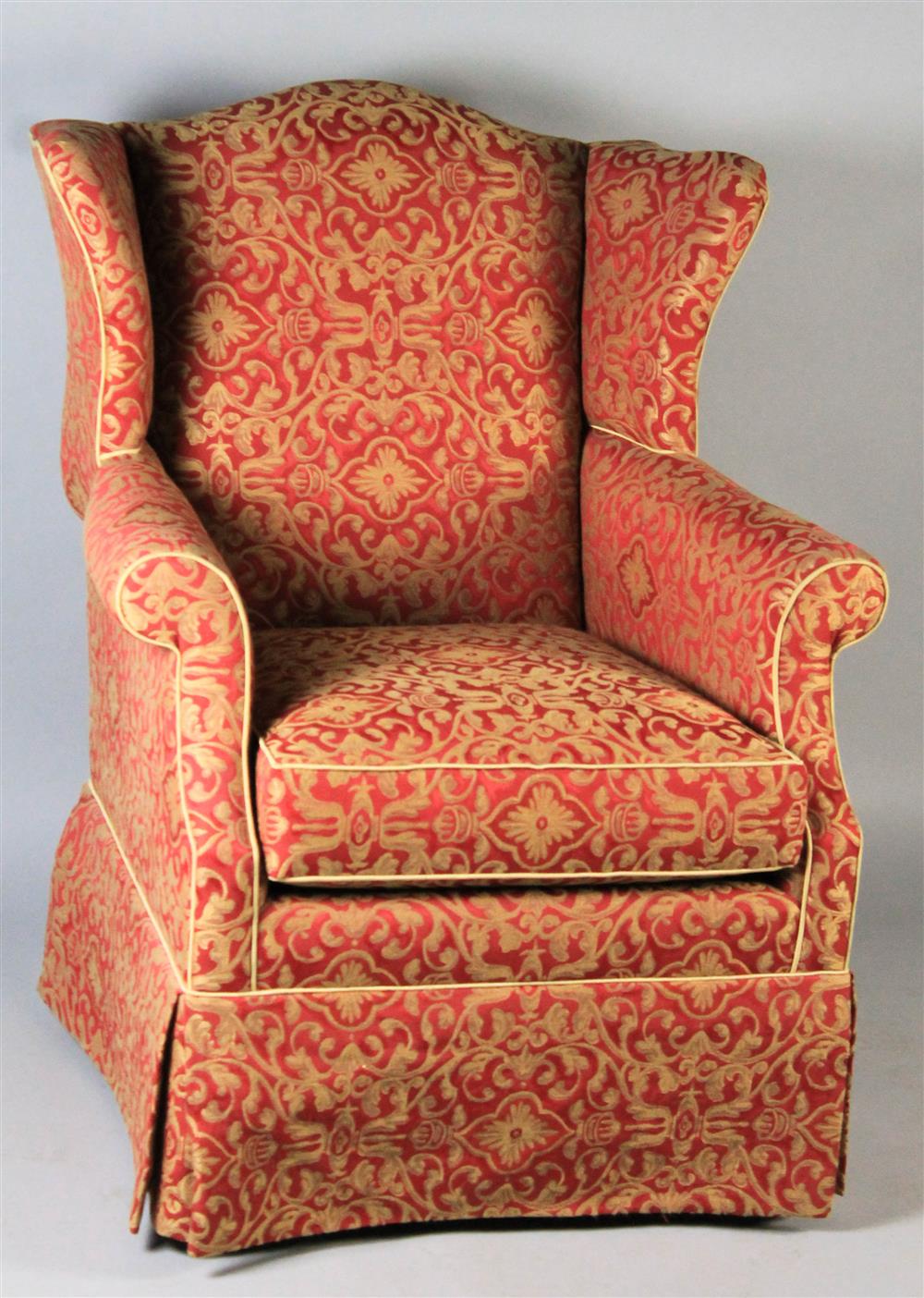 Appraisal: CHIPPENDALE STYLE WING CHAIR having an arched crest rail over