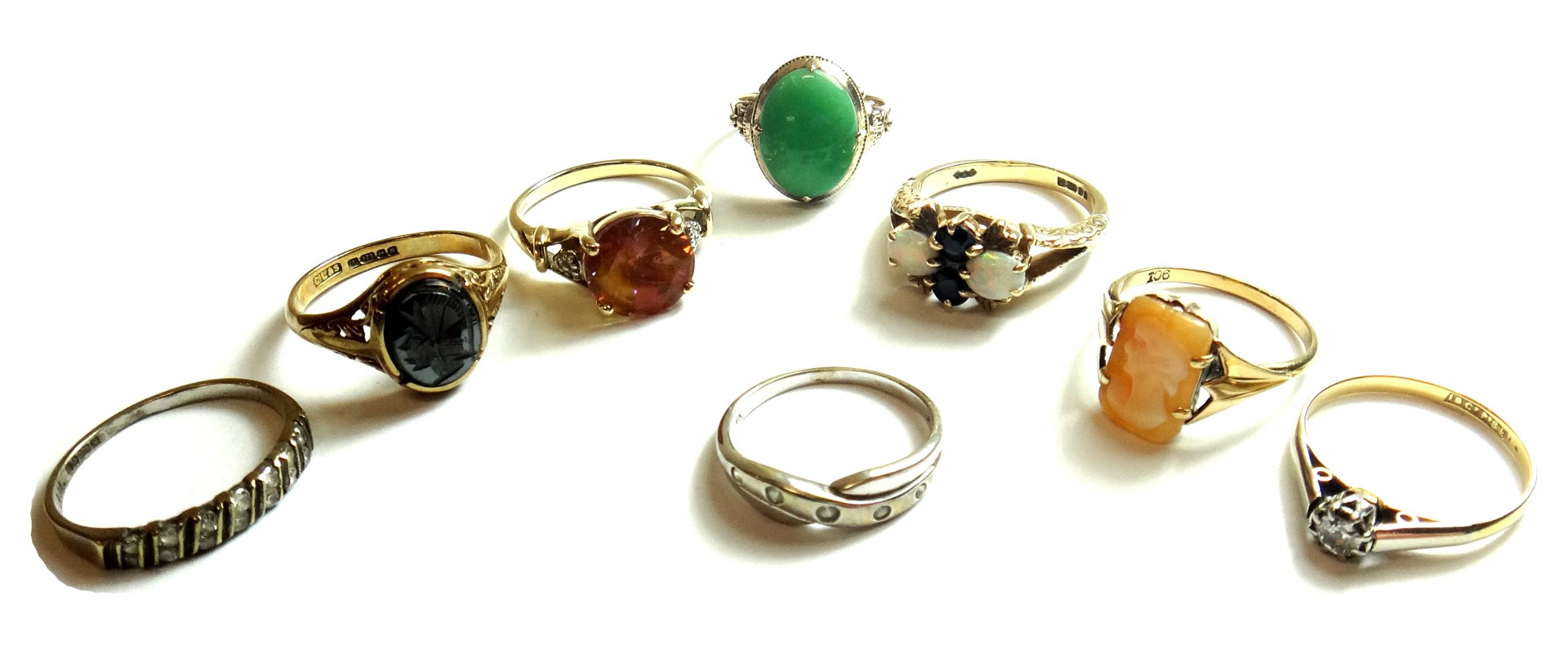 Appraisal: A gold ring claw set with an oval jade detailed