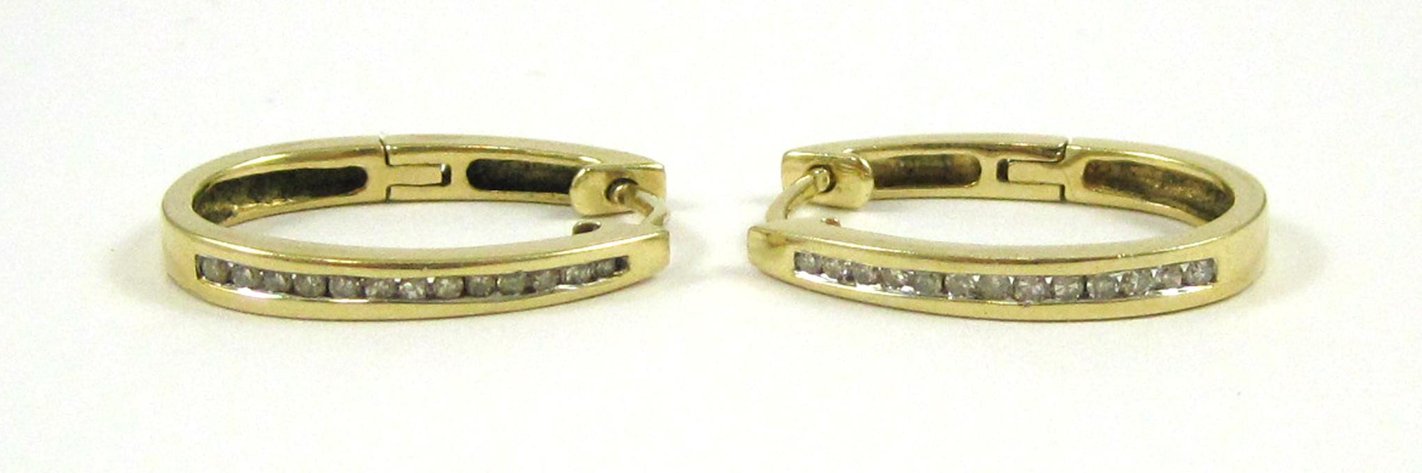 Appraisal: PAIR OF DIAMOND AND FOURTEEN KARAT GOLD EARRINGS Each yellow