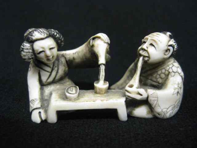 Appraisal: Chinese Carved Ivory Netsuke of Seatedman woman having tea ''