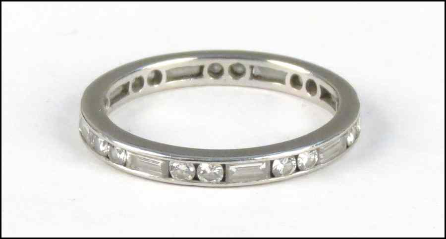 Appraisal: PLATINUM AND DIAMOND ETERNITY BAND Comprised of seventeen channel set