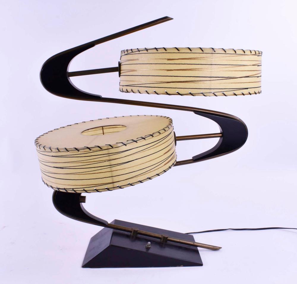 Appraisal: MID CENTURY MODERN ZEE TAMBOURINE LAMPThe undulating ebonized base with