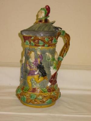 Appraisal: A MINTON MAJOLICA TOWER JUG with pewter hinged cover moulded