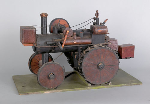 Appraisal: Whimsical wood steam tractor early th c mounted to a