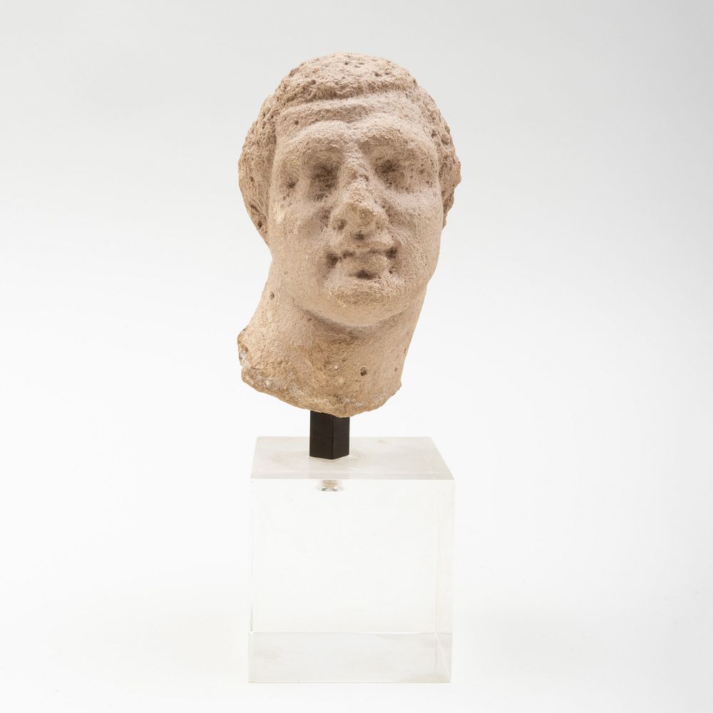 Appraisal: Greek Limestone Male Head Possibly Herakles Raised on lucite stand