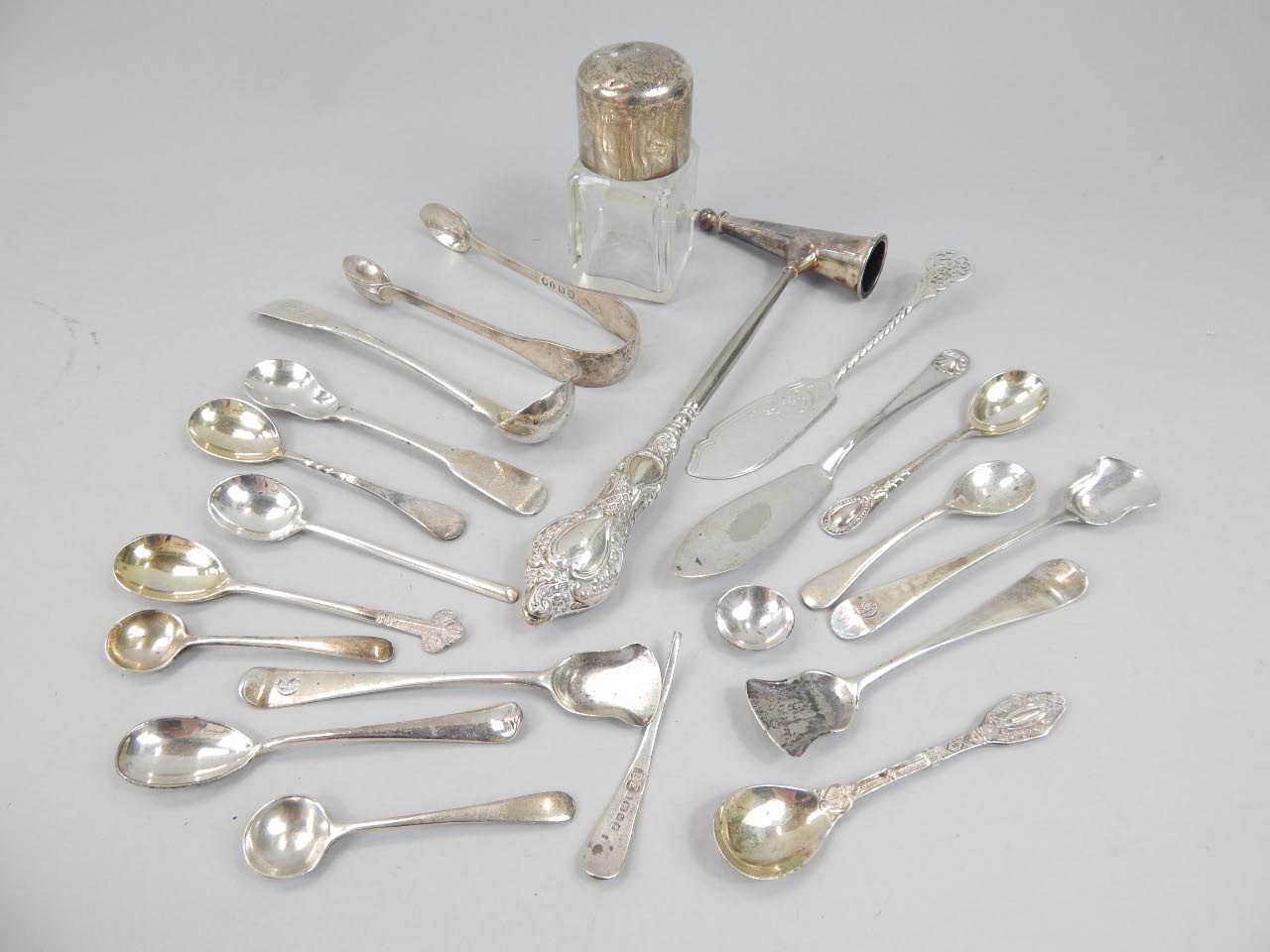 Appraisal: A cut glass perfume bottle with silver stopper and various