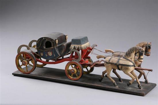 Appraisal: CARVED AND PAINTED CARRIAGE MODEL Late th-early th century mixed