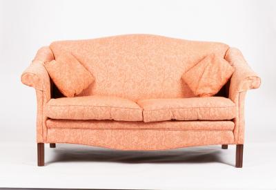 Appraisal: An upholstered sofa with arch back and scroll arms cm