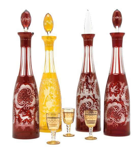 Appraisal: Collection of Four Bohemian Glass Decanters three in red cut