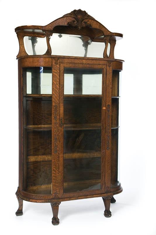 Appraisal: CHINA CABINET Oak having a carved and mirrored hutch top