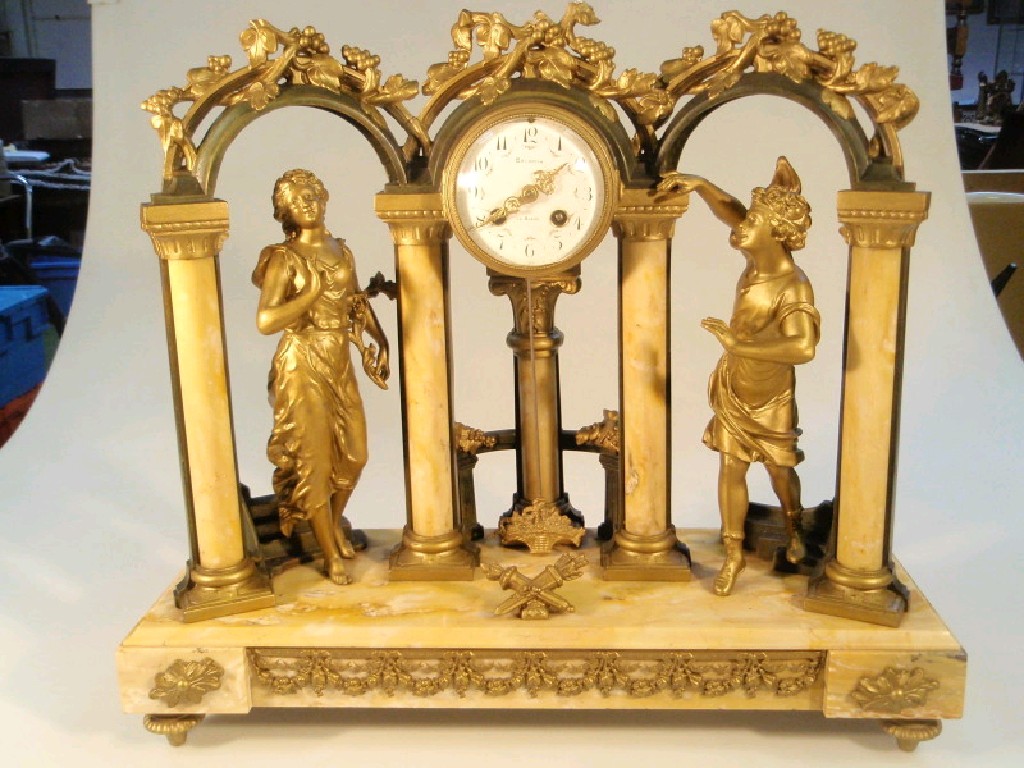 Appraisal: A thC French gilded spelter and marble mantel clock of