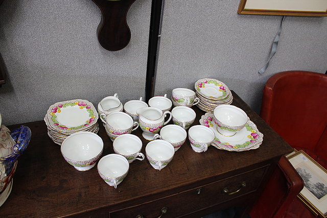 Appraisal: A ROYAL STANDARD BONE CHINA TEASET decorated with pink green