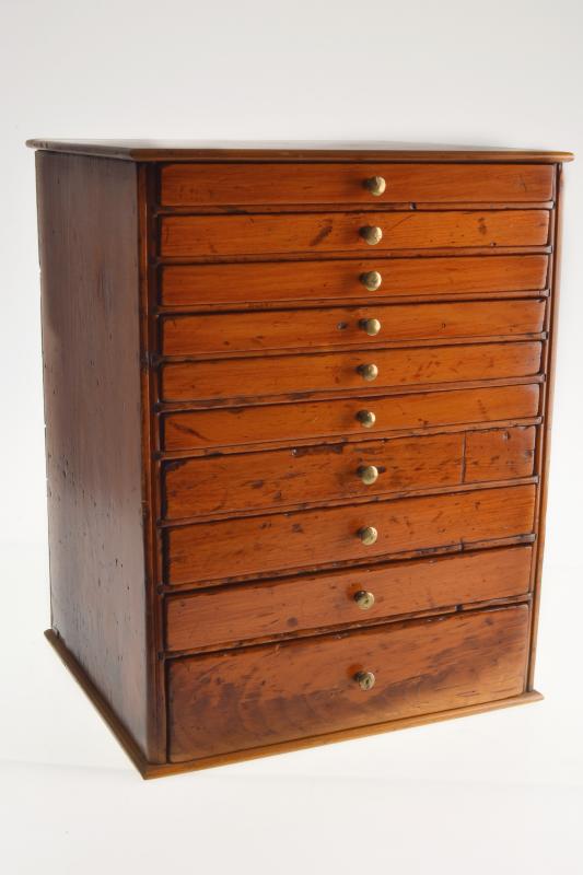 Appraisal: AN ANTIQUE PINE COLLECTOR'S CABINET drawers with side locking mechanism