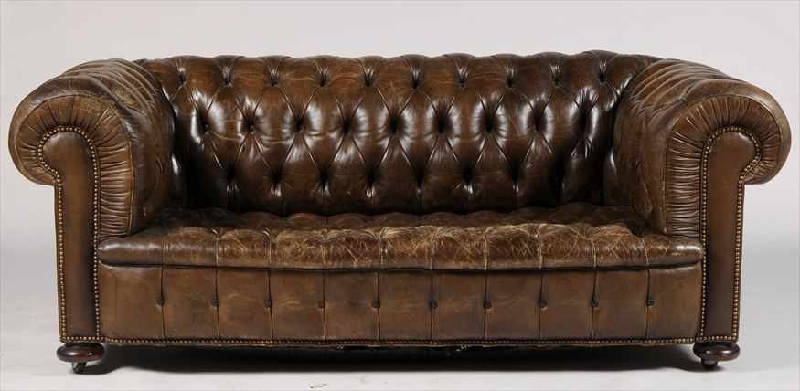 Appraisal: CHESTERFIELD TUFTED LEATHER SOFA Of typical form with outscrolled armrests