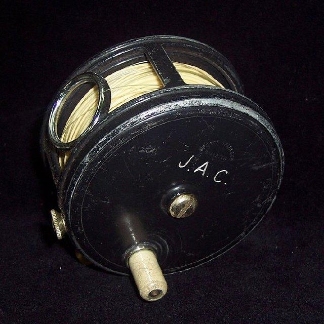 Appraisal: A George Smith alloy salmon reel with brass rod mount