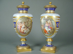 Appraisal: Pair of Vienna porcelain vases and covers of baluster form