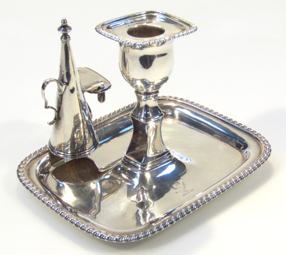 Appraisal: A George III silver taper candlestick with snuffer the bell