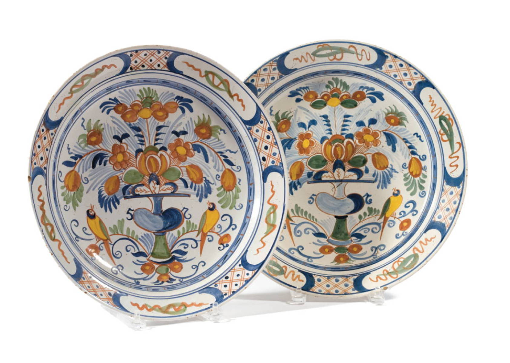 Appraisal: TWO SIMILAR DUTCH DELFT POLYCHROME DISHES EIGHTEENTH CENTURY Each painted